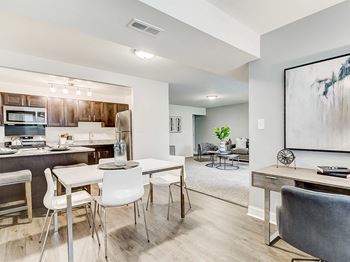 Den, dining room, and kitchen